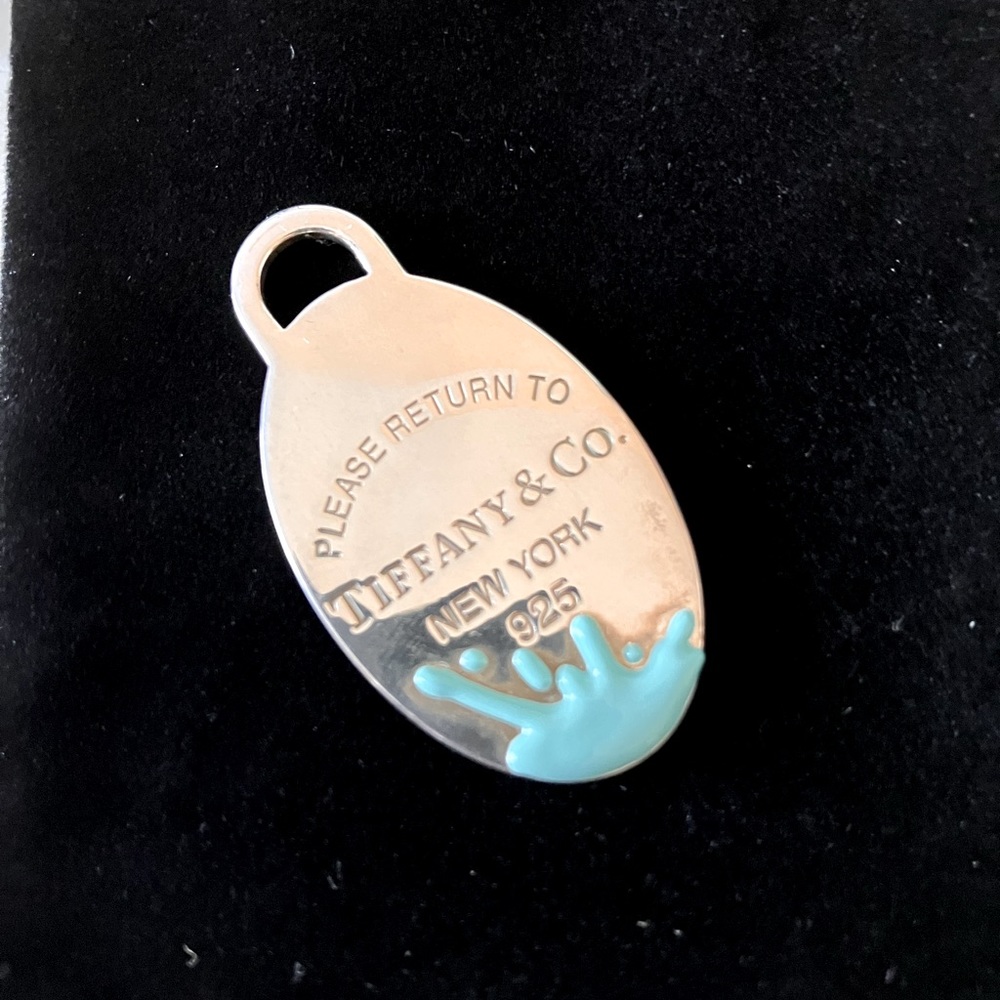 Authentic Return to Tiffany’s Oval dog tag with blue enamel splash